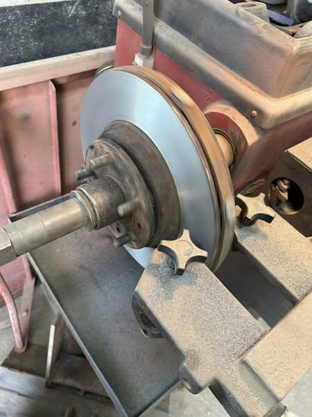 Brake rotor on lathe at Barnhardt Performance